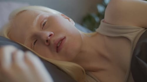 Young Woman Resting Indoors During Daytime