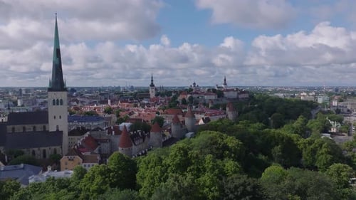 Aerial Footage of Historic City Center with Old Houses and Fortifications Tall Church Towers Against