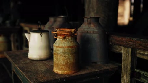Rustic Farmhouse Milk Cans and Kettle on Wooden Table