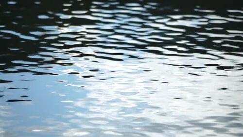 Sun Reflecting on Sparkling Sea Lake Water Surface Ocean at Sunset Sunrise