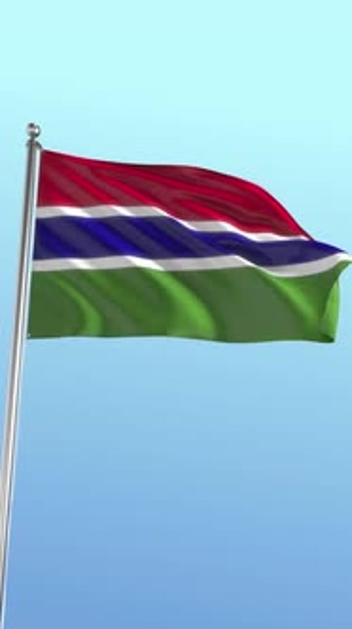 Flag of The Gambia Waving Against Blue Sky