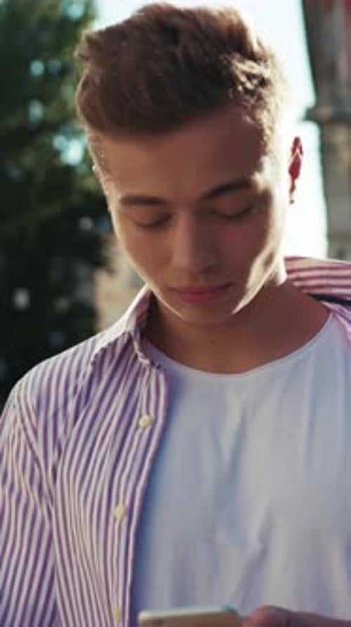 Face Young Happy Man Stand on Street Use Phone Look at Camera Smile Sunlight Cute Work Mobile Gadget