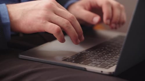 Closeup Business Man Hands Typing On Laptop Keyboard At Home Office In Slow Motion. Businessman H...