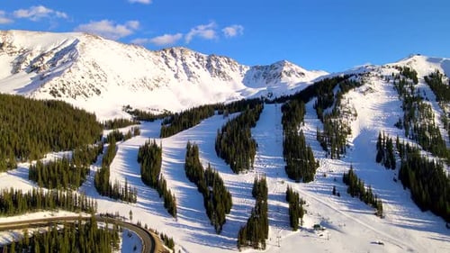 Flying over Alpine ski resort in Summit County, Rocky mountains.