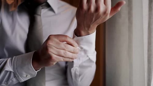 Man Adjusting Cufflinks Close Up