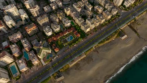 Aerial View Beachfront Vintage Villas with a Turquoise Pool and Lush Greenery Provide a Tranquil and