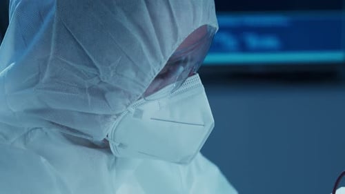 Microelectronics Engineer Works in a Modern Scientific Laboratory on Computing Systems and