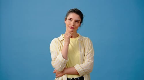 Thoughtful Woman Considering an Idea in Studio