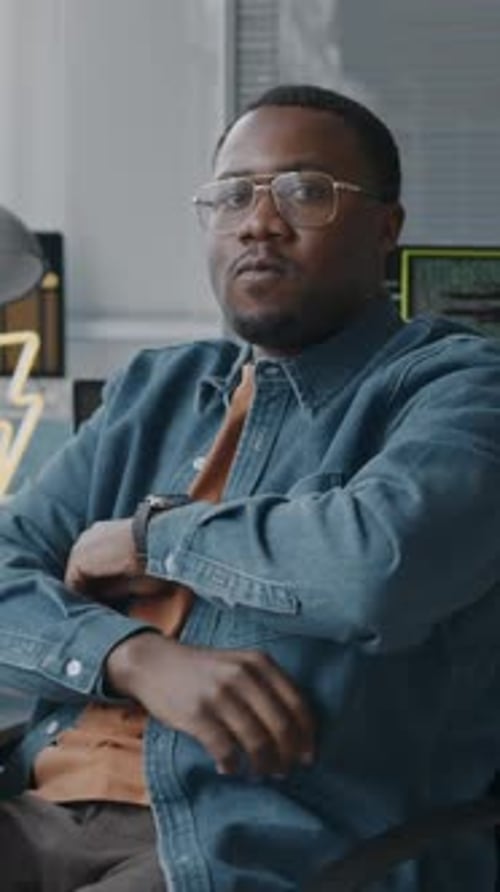 Vertical Portrait of African American System Administrator in Office