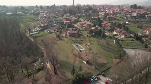 Residential Houses In The Countryside Surrounded By Green Meadows And Trees In Northern Italy - aeri