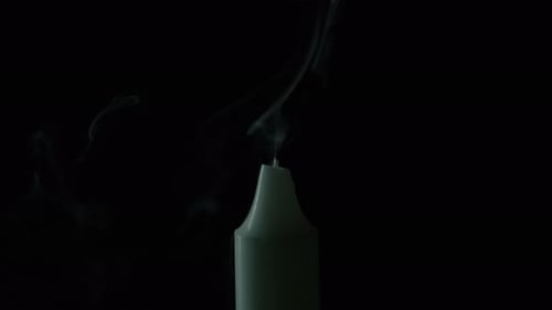 Candle Flame Extinguished and Smoke Rising on Black