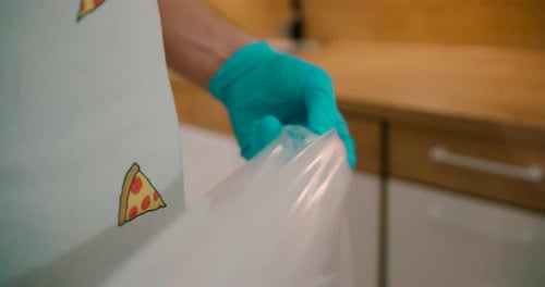 Hands In Gloves Of A Chef Preparing Pastry Bag.