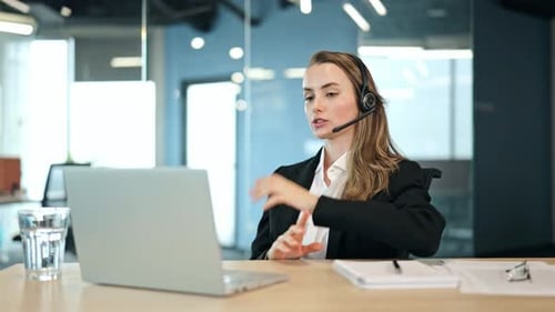 Professional Woman Teleconferencing in Modern Office