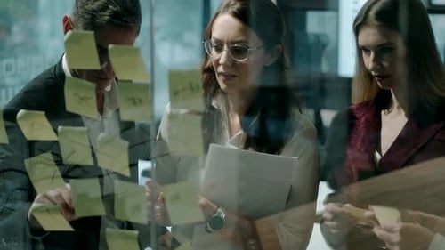 Collaborative Team Working on Project in Modern Office