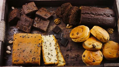 Different Kinds of Cakes Arranged on a Wooden Tray