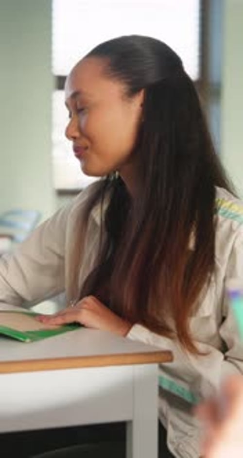 Students, college and girl in classroom for writing notes, studying and learning in lesson