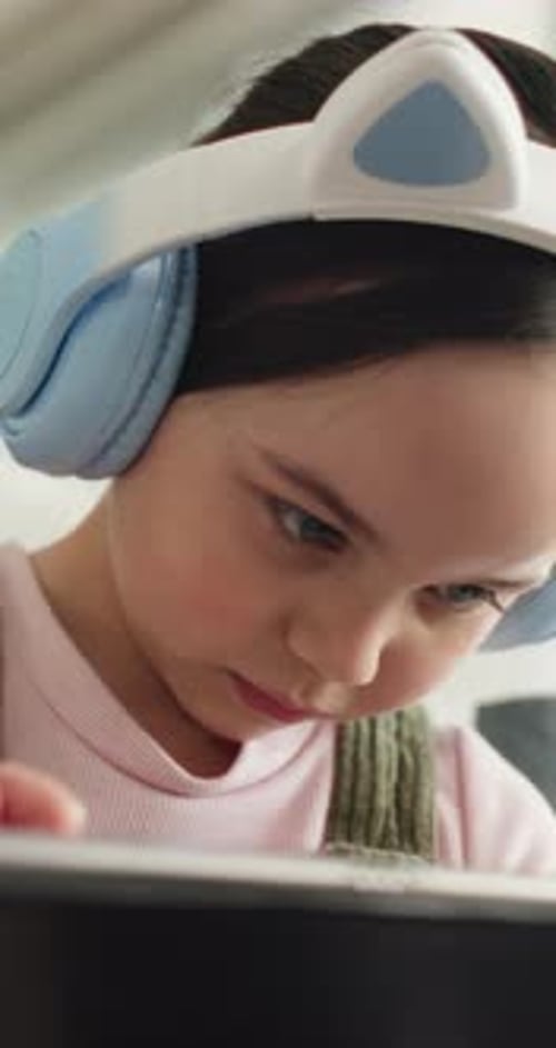 E learning, headphones or child in home with tablet, online activity or project on academic
