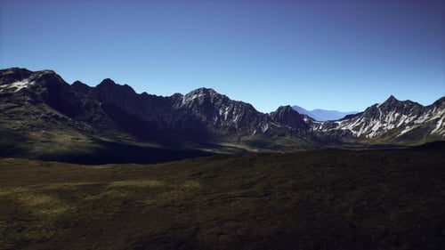 Breathtaking Mountain Landscape Under a Clear Blue Sky in a Remote Wilderness