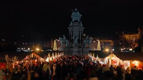 4K Winter Holiday Christmas Village Market Lit Up At Night on Maria-Theresien-Platz, Vienna, Austria