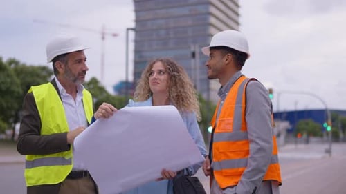 Architect and Engineers Discussing Building Project on Construction Site