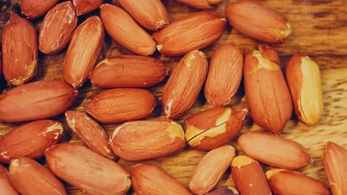 Close-up of Fresh Peanuts on Wooden Surface