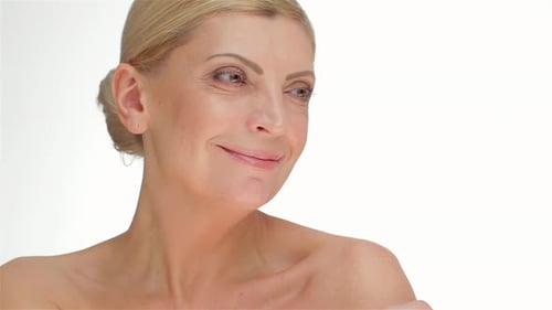 Woman Touching Shoulder in Simple Close Up Shot