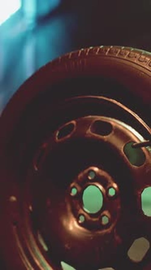 A Close Up of a Tire on a City Street