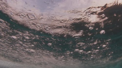 Underwater view of the breaking wave in the Maldives