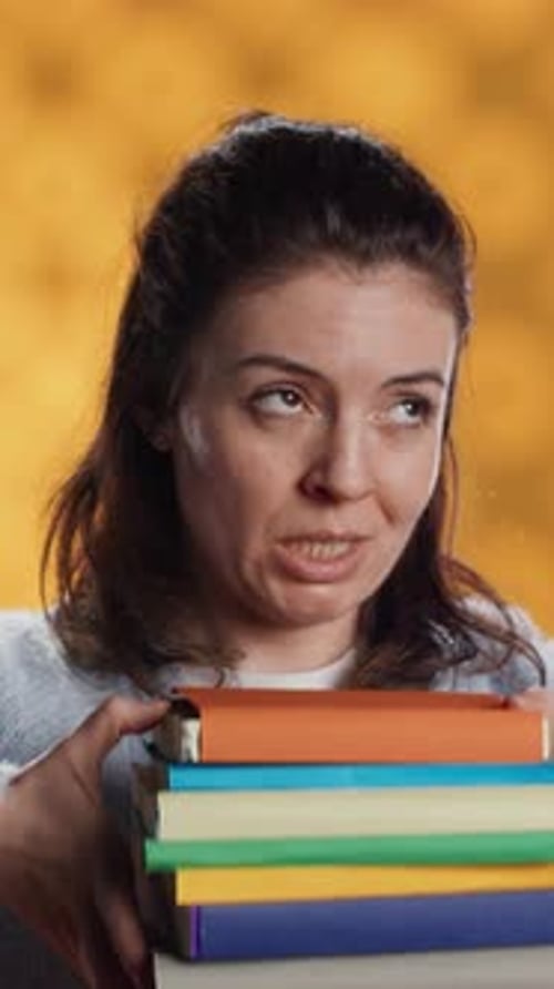 Vertical Video Woman Choosing Between Physical Books and Ebooks Favoring Ereader for Lightness