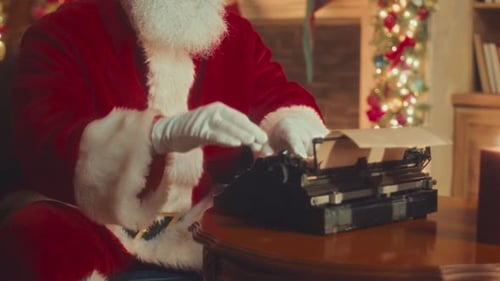 Santa Claus Typing on Typewriter at Christmas
