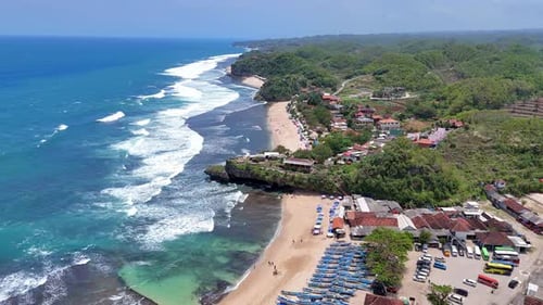 Beautiful aerial footage of a tropical beach with rolling ocean waves