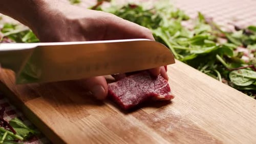 Dicing Meat on Wooden Cutting Board for Cooking