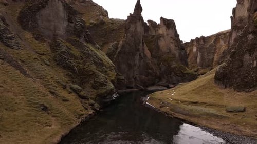 river flowing through Fjaðrárgljúfur canyon