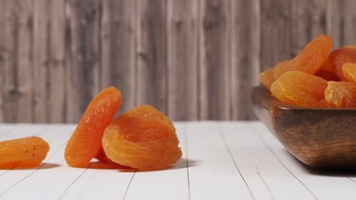 Dried Apricots in Wooden Bowl Close Up