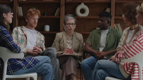 Therapy Session with Adults in a Wood Paneled Office