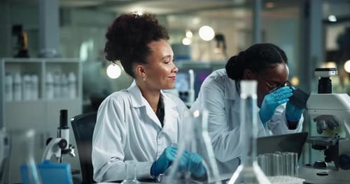Science, women and high five in lab with microscope, cheers and medical research for pharmaceutical