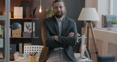Slow Motion Portrait of Confident Businessman Standing in Office Room with Arms Crossed and Looking