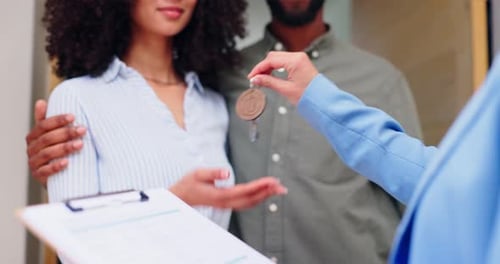 Couple Receives Keys to Their New Home