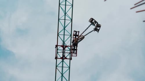 Tower Crane Hook Assembly Against Cloudy Sky