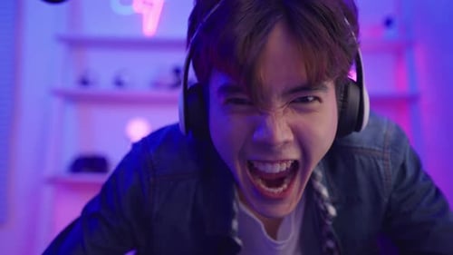 Young Adult Cheering in Front of Monitor