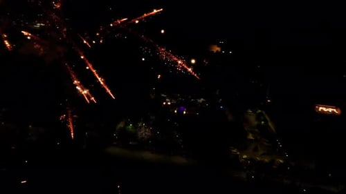 Night Aerial View of Festive City Fireworks Display