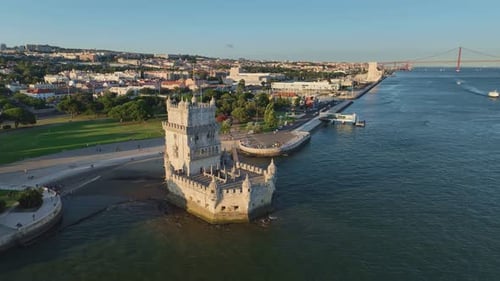 Aerial Drone View of Belem Tower on the Bank of the Tagus River at Sunset Lisbon Portugal