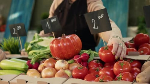 Woman Selling Fresh Vegetables at Local Market
