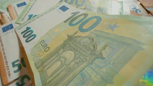 Detailed view of 100 euro banknote showcasing design and features