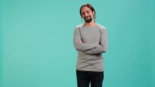 Adult Man with Beard and Arms Crossed Smiling
