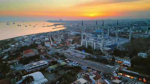 Aerial drone view of Istanbul at sunset, Turkey. The Blue Mosque, with gardens and buildings around,