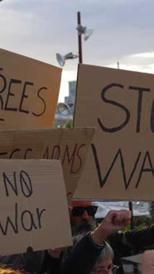Protesters Holding Signs at a Protest in a City