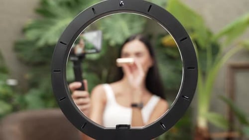 Young Woman Vlogging About Makeup With Ring Light