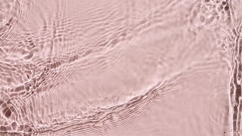 Water Surface Texture Top View Water Waves Pink Colored Sun and Shadows Pure Blue Water with