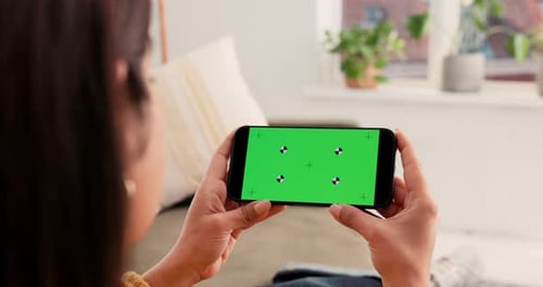 Woman, hands and phone with green screen for entertainment, UI advertising or UX in home
